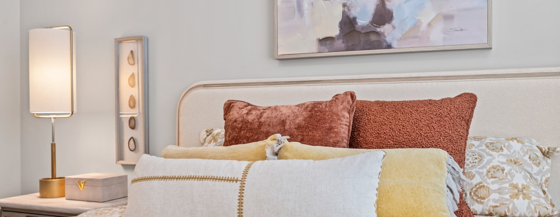 close-up of a bed with decorative pillows