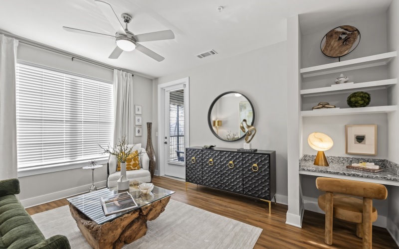 living room with a built-in desk, coffee table and couch