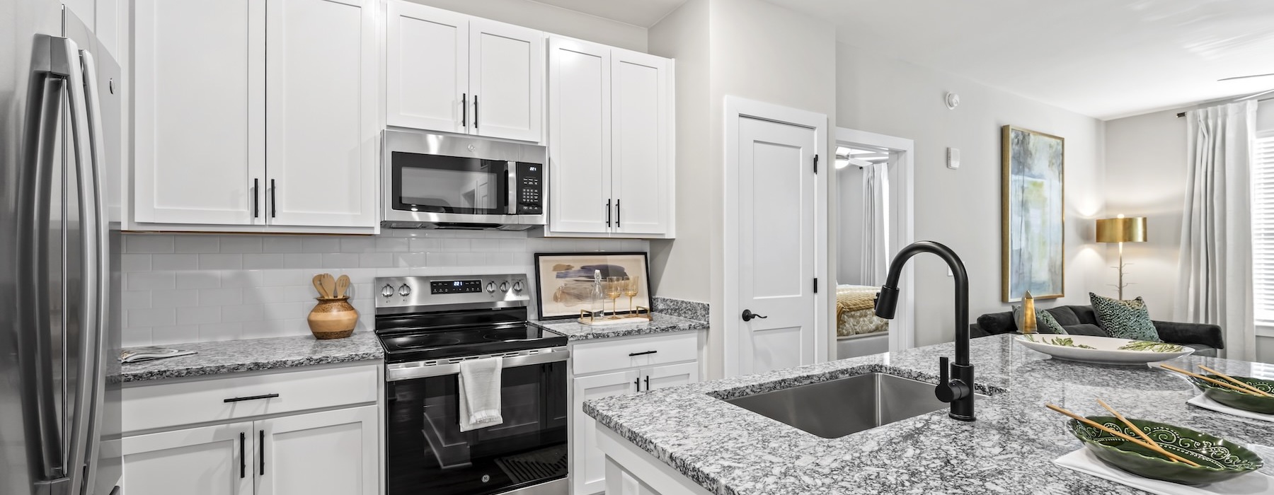 kitchen with stainless steel appliances and an island with bar stools